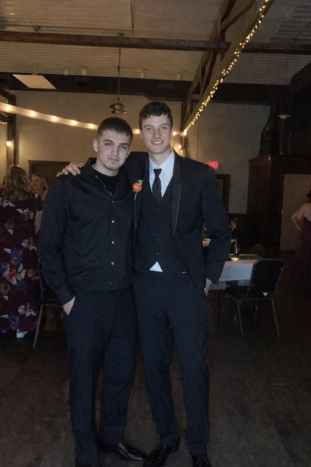 Ian Flynn in a suit on the right at a formal event