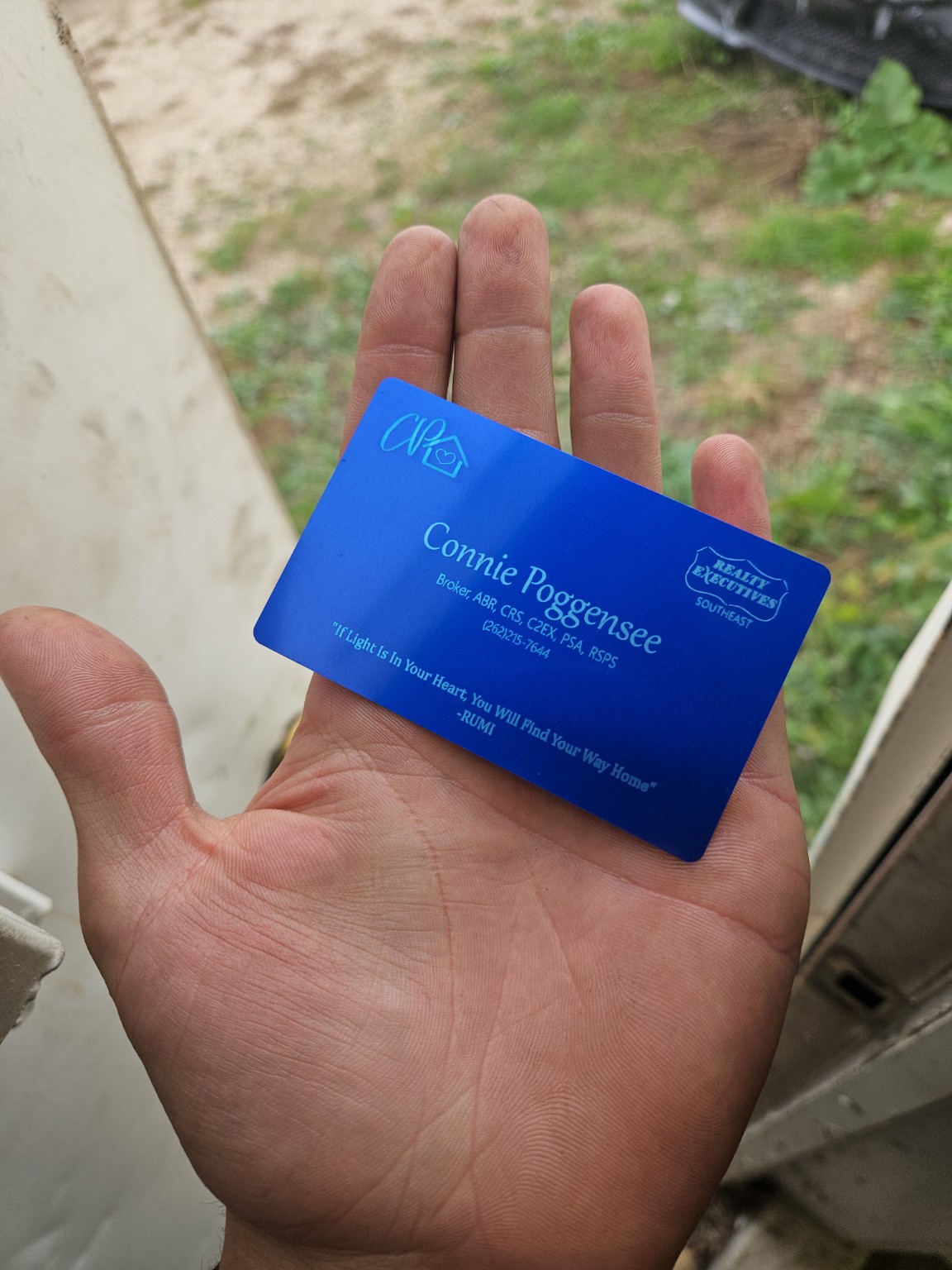 Blue engraved metal real estate business card